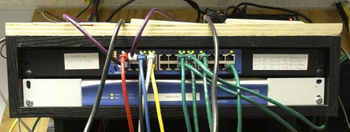 AFTER photo of new LAN switch and with reorganized WAN router, modems, and gateways. 